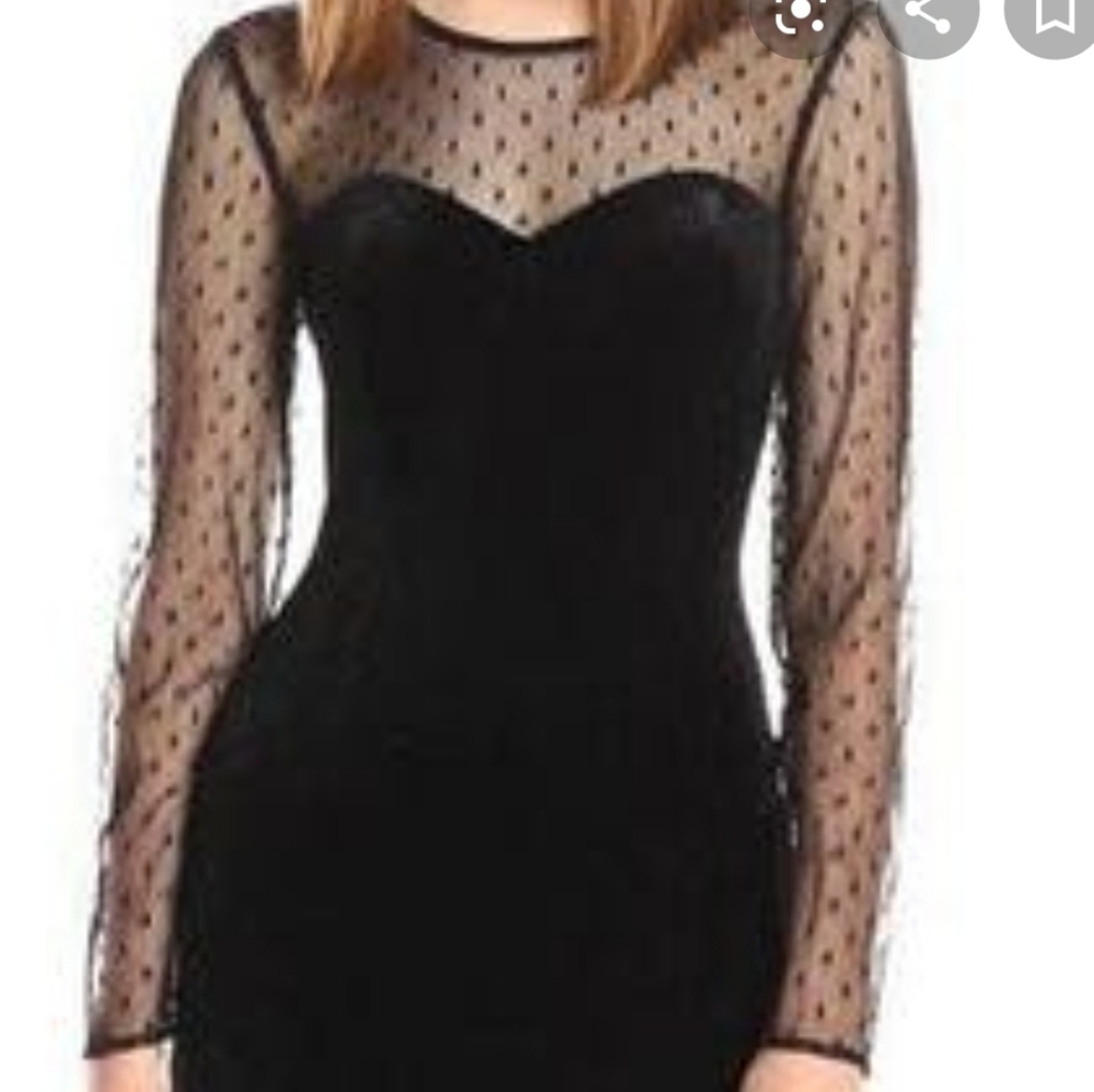 Bodycon dress with long mesh sleeves.
